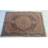 A Persian rug with a central medallion,