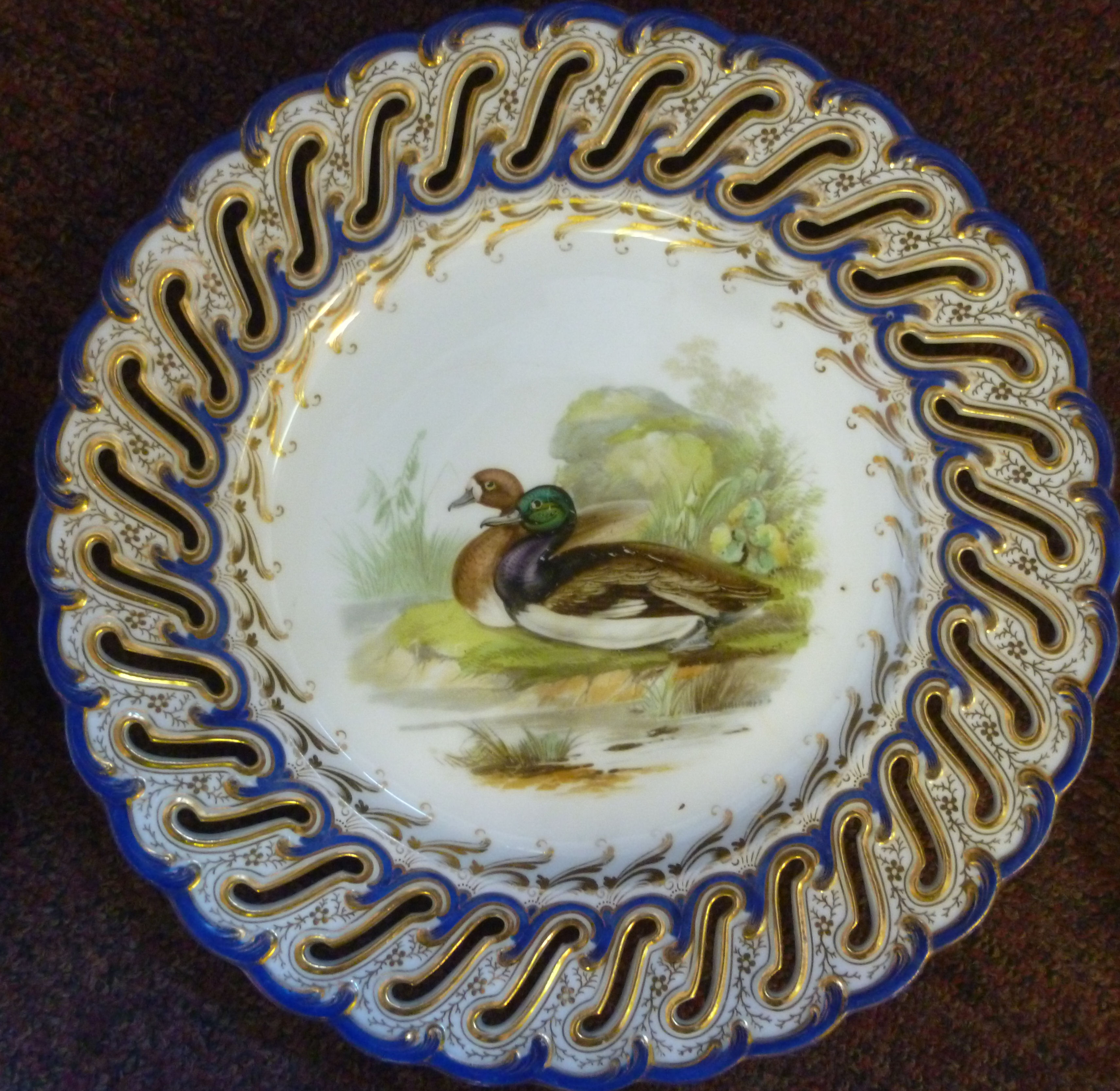 A set of six late 19thC china dessert plates and a matching comport with uniformly pierced and - Image 6 of 12