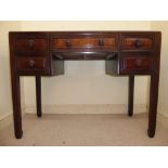 A 20thC Chinese rosewood and burr walnut veneered kneehole desk,
