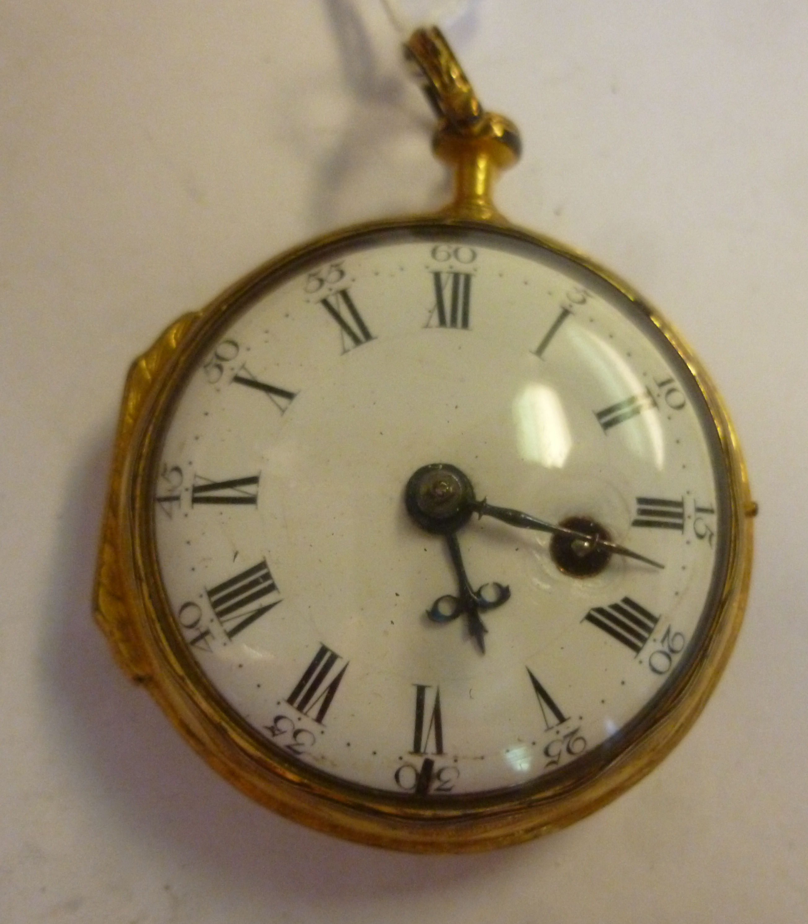 An early 19thC engraved and chased gilt metal cased pocket watch, the fusee movement inscribed Ja.