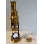 An early 20thC student's lacquered brass microscope,
