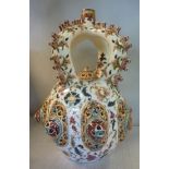 A late 19thC Zsolnay Pecs china bulbous, crown top vase,