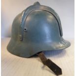 A World War II Hungarian/Axis green painted helmet with typical cruciform reinforcement,