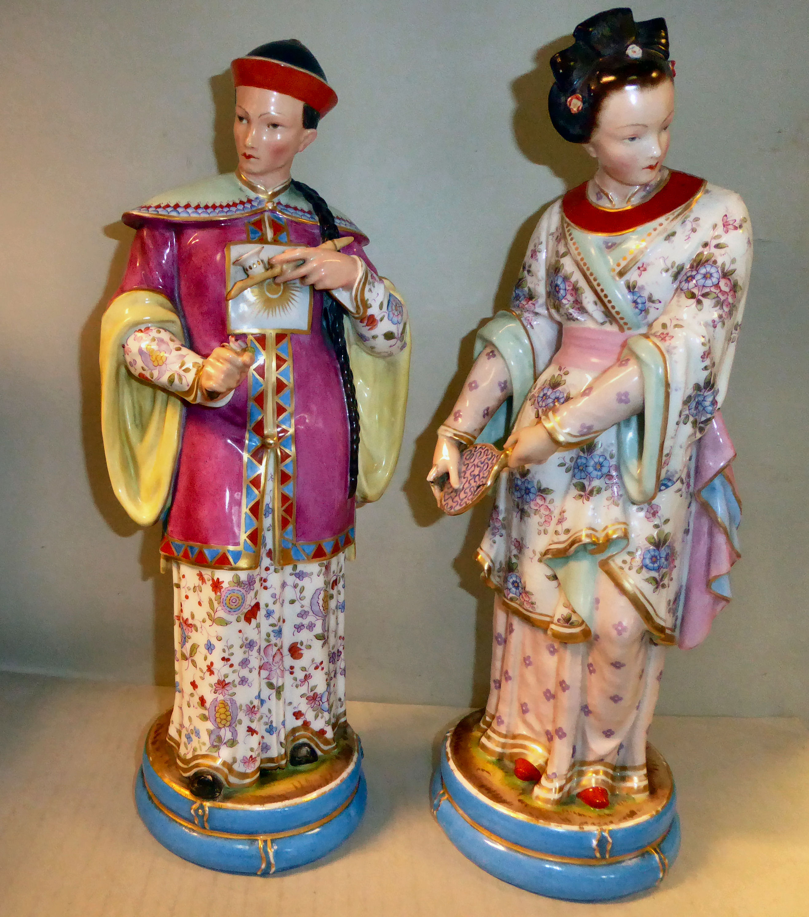 A pair of late 19thC Continental porcelain figures,