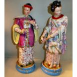 A pair of late 19thC Continental porcelain figures,
