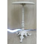 A mid Victorian white painted cast iron pedestal table, the tip-top with an egg-and-dart border,