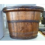 A 19thC rustically constructed coopered iron and pine oval 'bucket' with a wide everted lip and