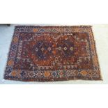 A Shiraz rug with a pair of diamond shaped medallions,