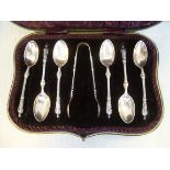 A set of six late Victorian silver apostle teaspoons with a pair of matching sugar tongs John