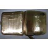 A 9ct gold curved, cushion shaped, folding cigarette case,