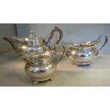 A three piece silver tea set of circular ogee bowl design,