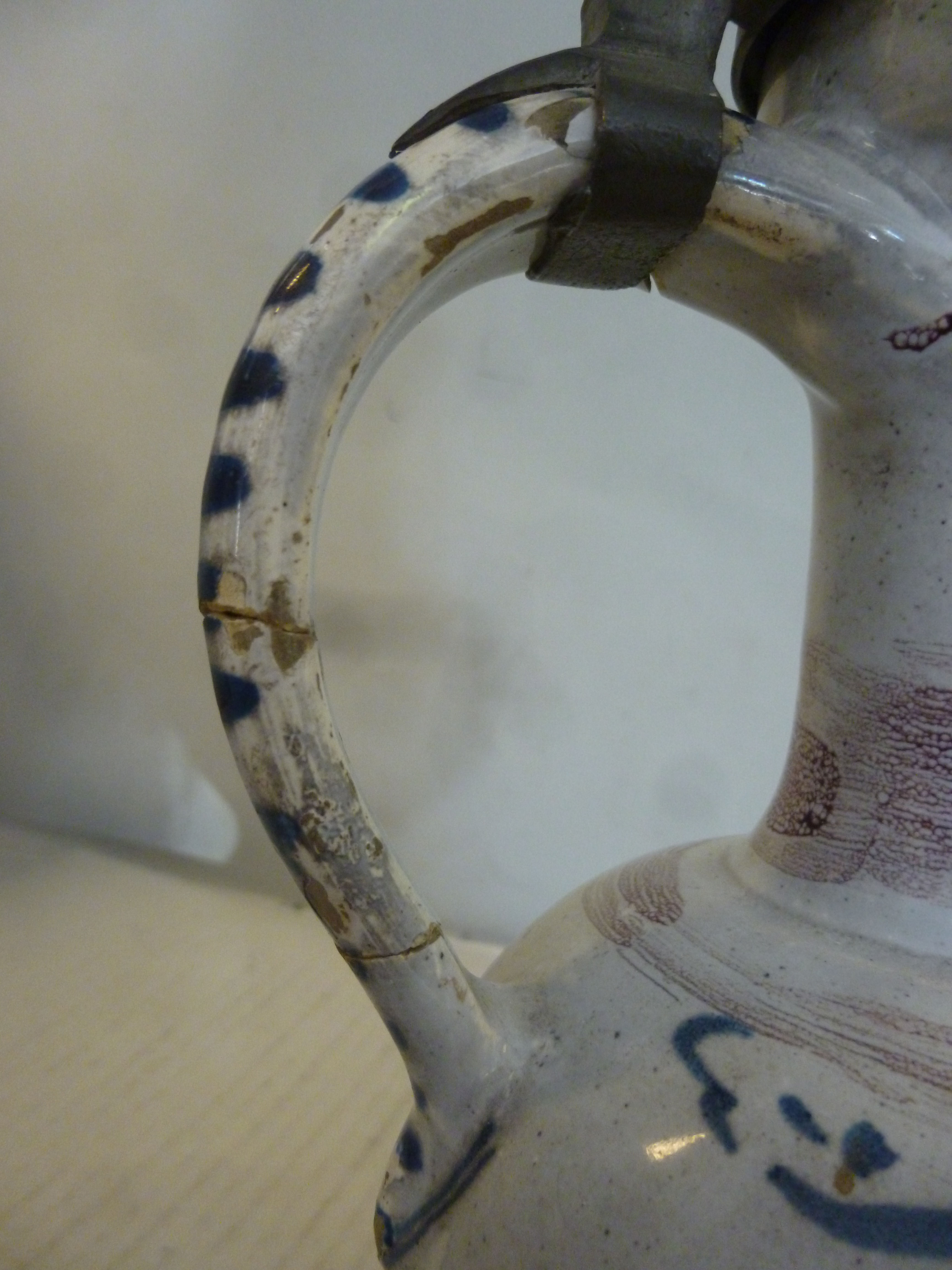 An 18thC German/North European Delftware ewer of bulbous form with a long narrow neck, loop handle, - Image 7 of 11