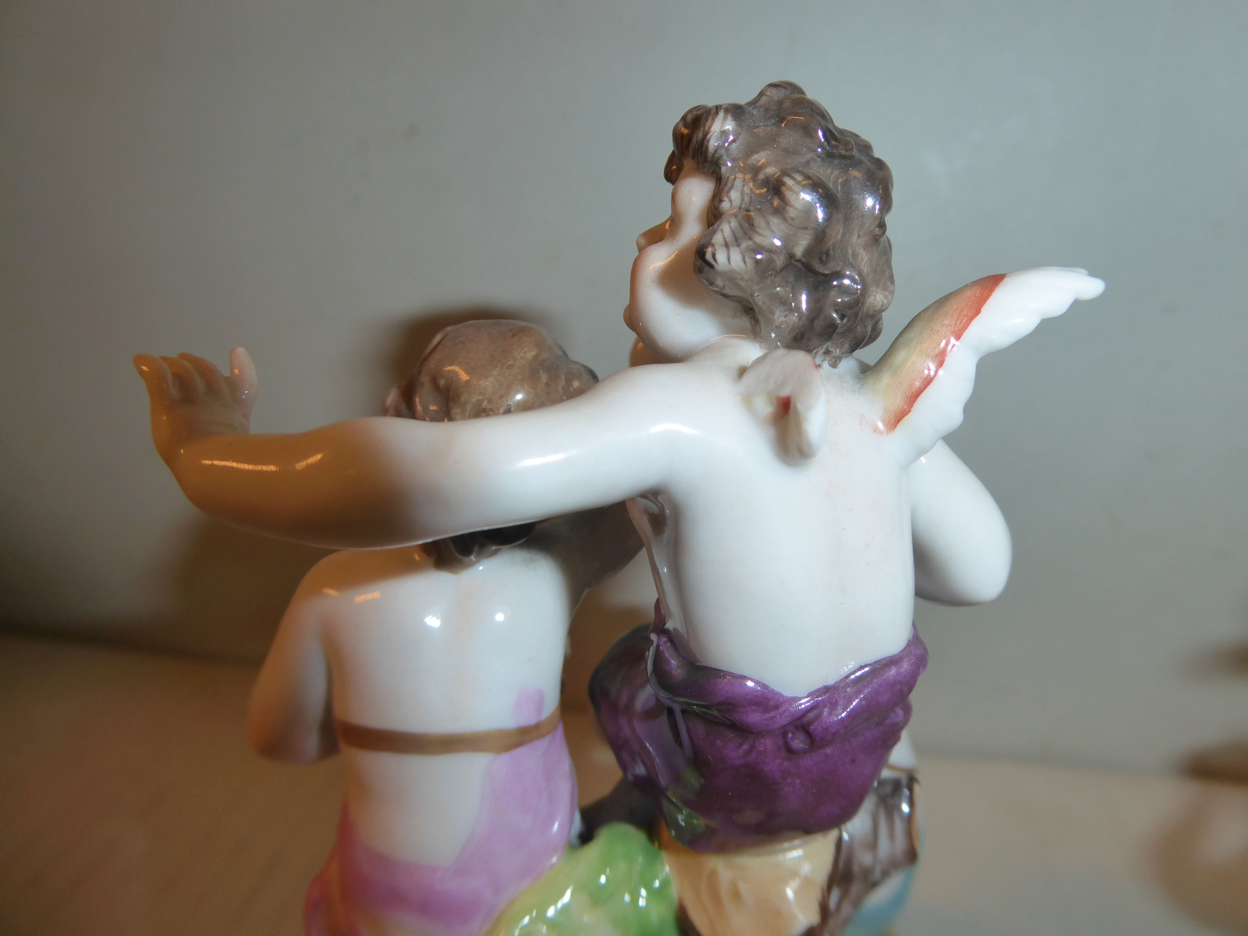 A pair of early 20thC Naples porcelain groups, cherubs playing musical instruments 5. - Image 4 of 6
