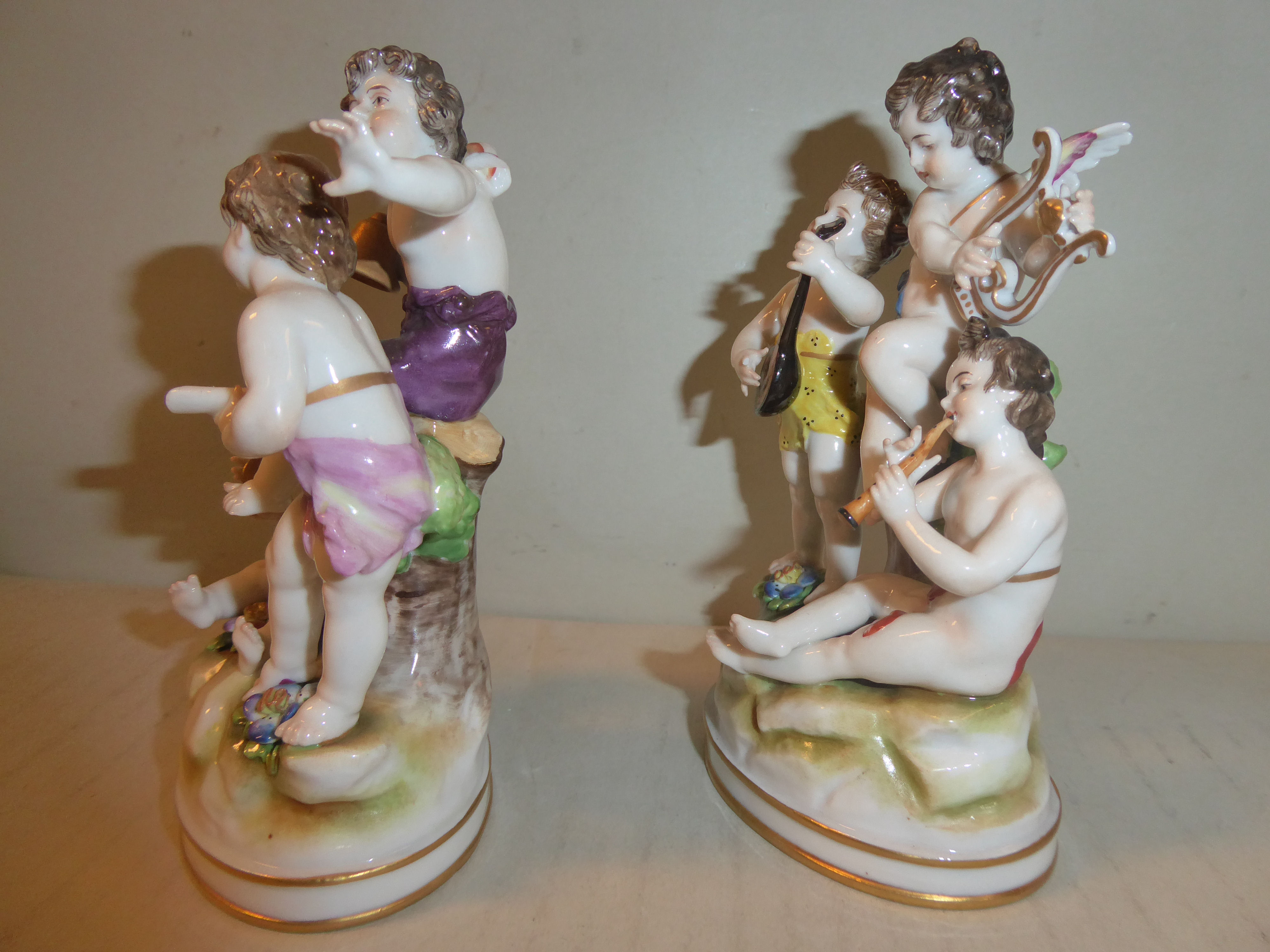 A pair of early 20thC Naples porcelain groups, cherubs playing musical instruments 5. - Image 2 of 6