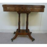An early 19thC string inlaid mahogany card table, the rotating, green baise lined,