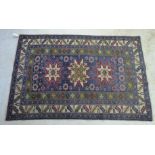 A Caucasian rug with three star shaped medallions,