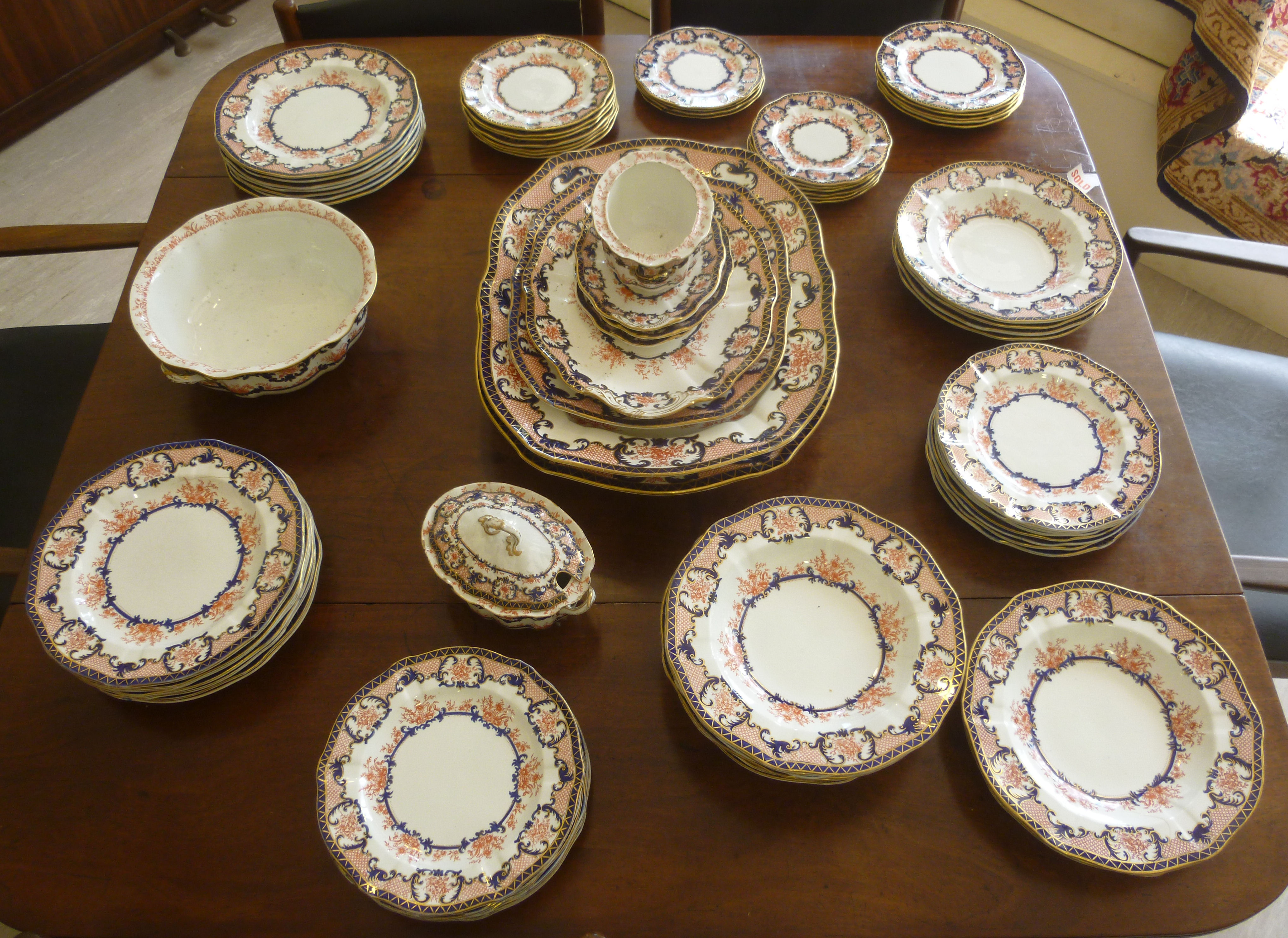 Early 20thC Royal Crown Derby stoneware china tableware, decorated in iron red,
