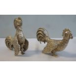 A pair of foreign white metal miniature models,