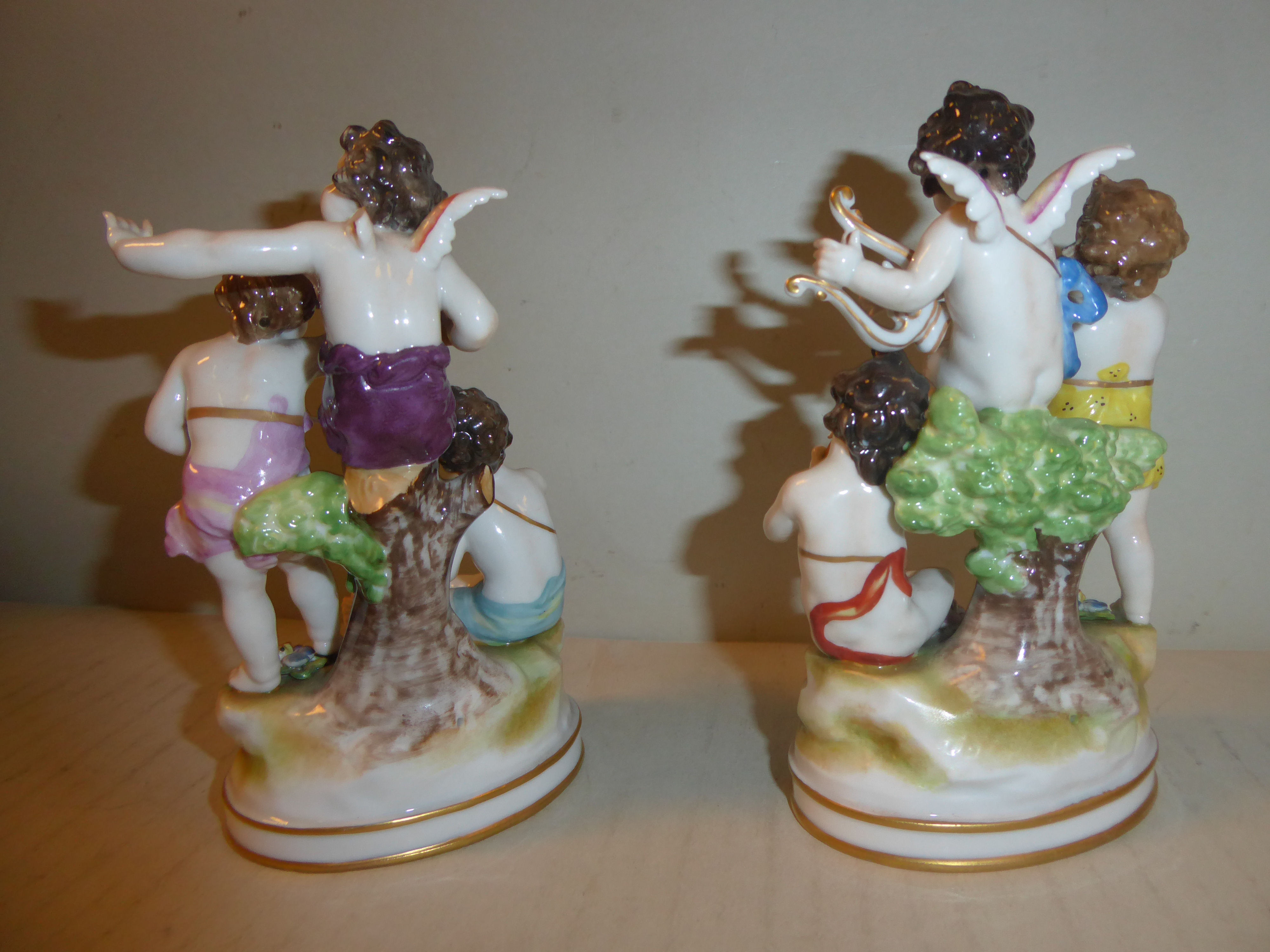 A pair of early 20thC Naples porcelain groups, cherubs playing musical instruments 5. - Image 3 of 6