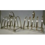 A pair of Edwardian reeded silver wire toastracks with four arched divisions and heart shaped loop