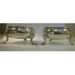 A matched pair of George II/III silver bead bordered, bulbous circular salt cellars,