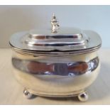 An early 19thC silver mustard pot of ogee box design with a clear glass liner,