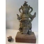 A 19thC Chinese cast bronze standing figure, bearing traces of gilding,