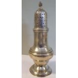 A George III silver pedestal vase design pepper pot with bead borders,