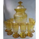 An early 20thC Bohemian amber coloured glass punch vase of multi-panelled,