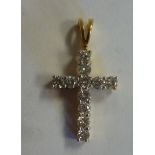 An 18ct gold and diamond set pendant cross