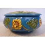 A modern Moorcroft pottery powder bowl and cover, decorated in colours and tubeline with Sunflowers,