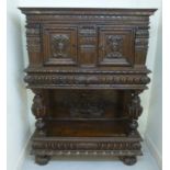 A late 19th French profusely carved and panelled walnut buffet,