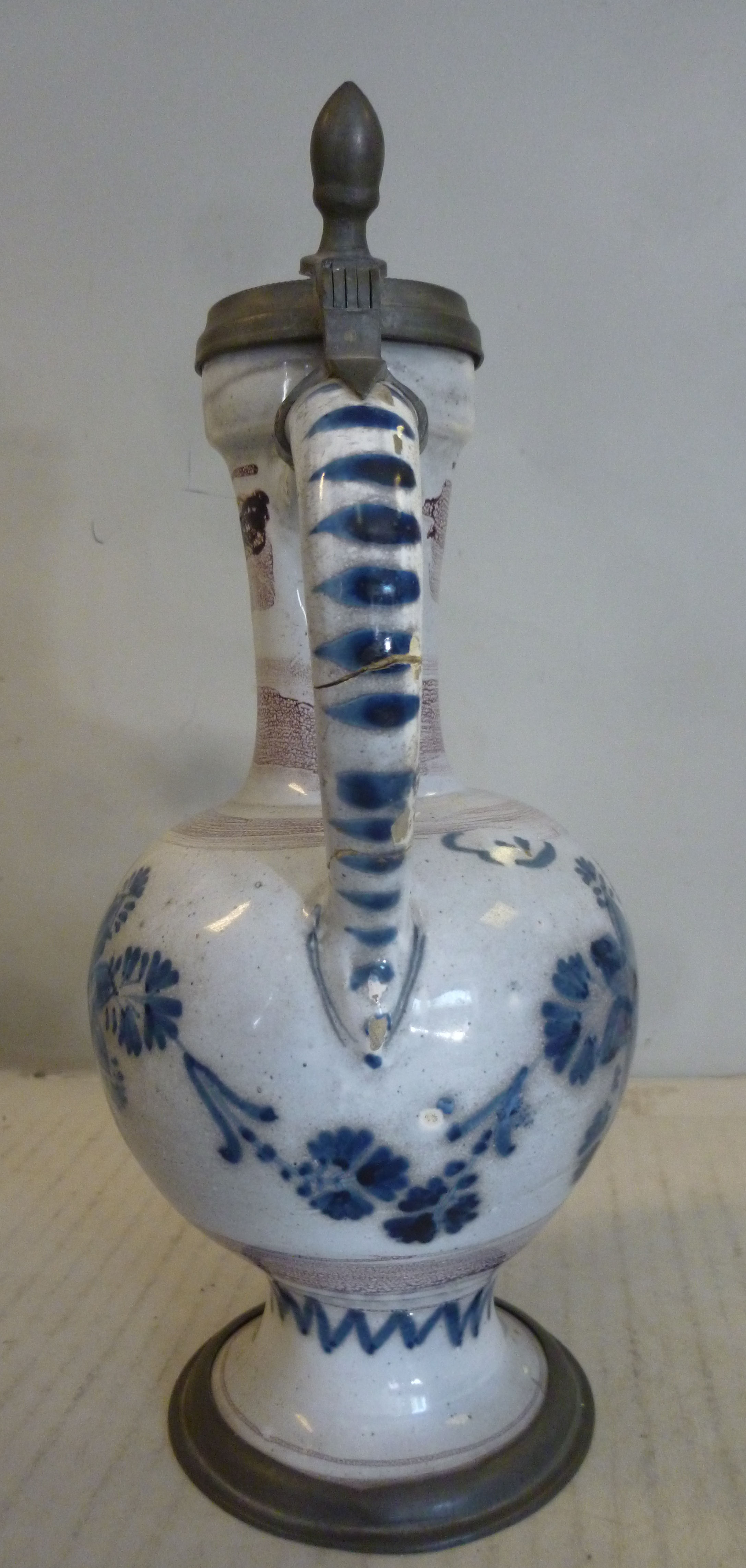 An 18thC German/North European Delftware ewer of bulbous form with a long narrow neck, loop handle, - Image 4 of 11