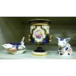A Royal Crown Derby china twin handled pedestal vase, decorated with flora and gilding,