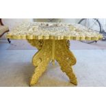 A Colonial, later cream painted, Indian teak occasional table,