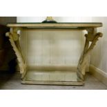 An Art Deco carved, cream painted and part gilded coffee table with a mirror panelled top,
