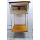 A 20thC painted and waxed pine bedside cabinet with a single drawer,