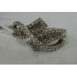A 14ct white gold fancy diamond set crossover ring 11
