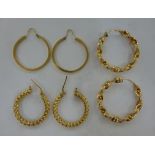 Three dissimilar pairs of 9ct gold large hoop earrings 11