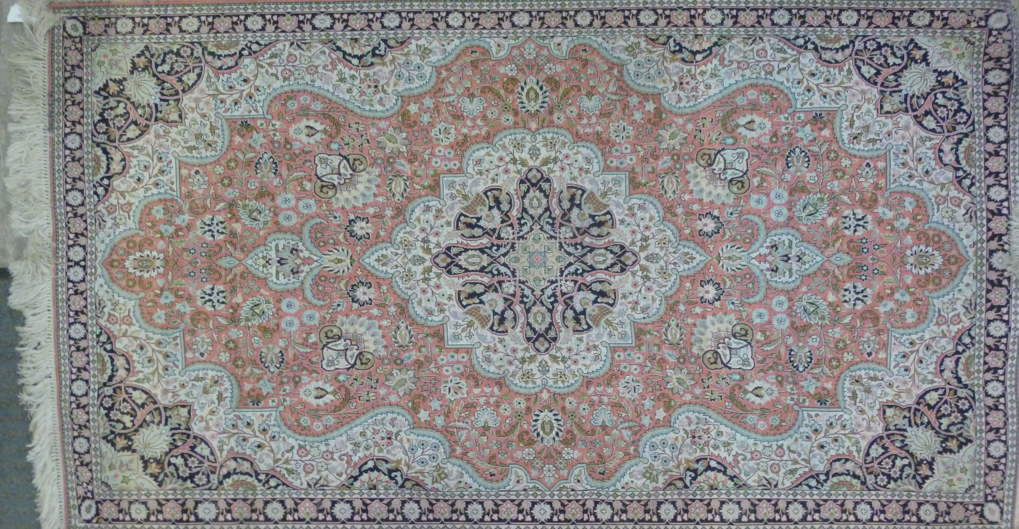 A modern silk rug with a central serpentine outlined medallion, bordered by flora and foliage, - Image 5 of 7