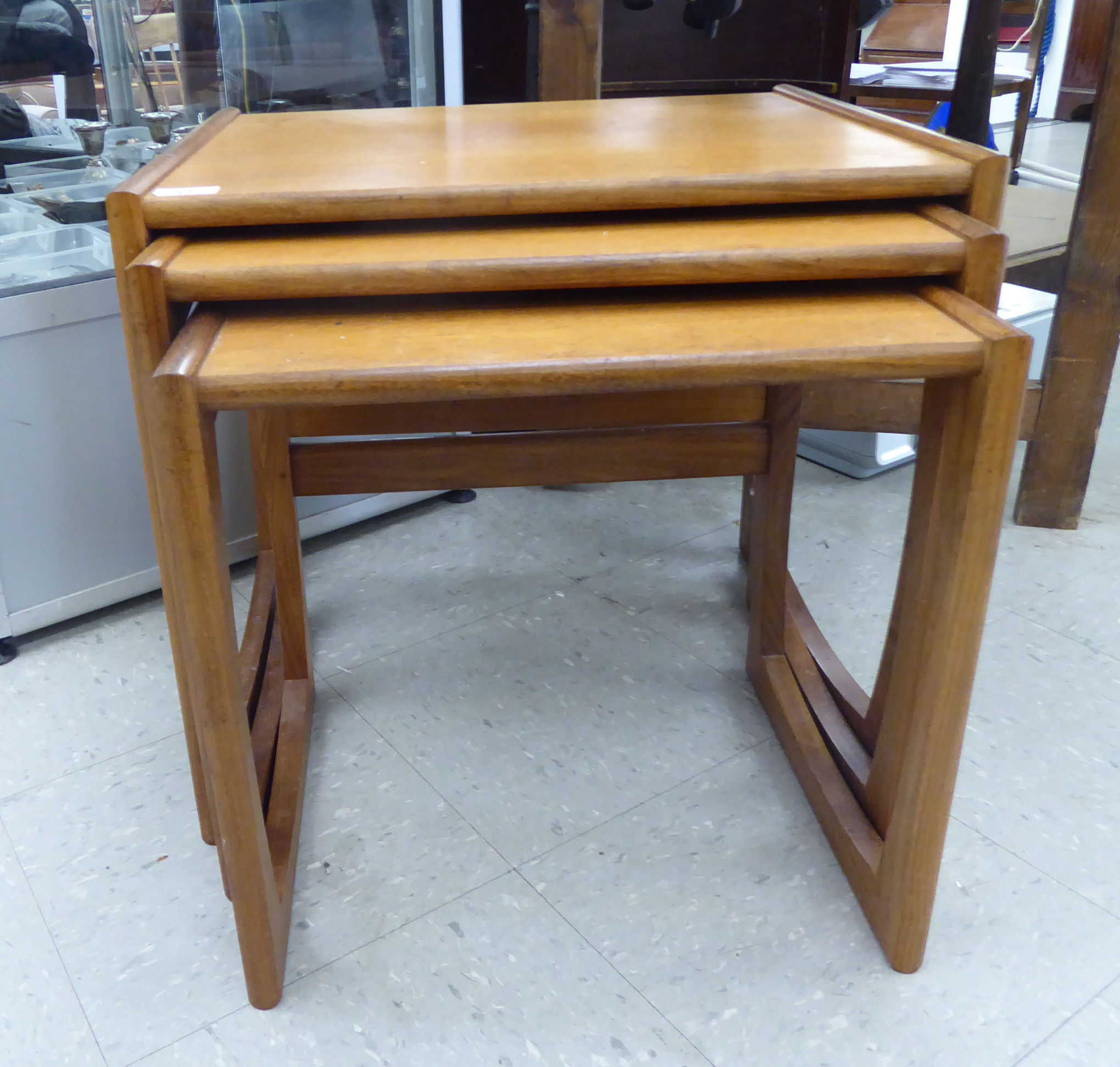 A nesting set of three G-Plan teak occasional tables,