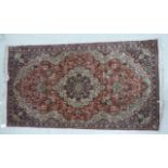 A modern silk rug with a central serpentine outlined medallion, bordered by flora and foliage,
