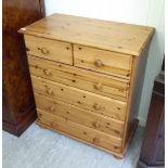 A modern waxed pine dressing chest with two short/four long drawers,