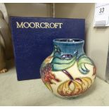 A modern Moorcroft pottery vase of squat bulbous form,