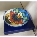 A modern Moorcroft pottery pin dish, decorated in tubeline with a floral design 3.