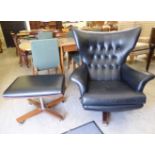 A 1970s G-Plan wingback style desk chair, the part button upholstered black faux hide back,