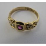 An 'antique' 18ct gold ring, set with a central ruby,