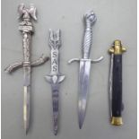 Three reproduction daggers with decoratively cast handle the blades 5-6''L;
