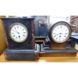 A late Victorian black slate mantel clock; the 8 day movement faced by a Roman dial 11''h;