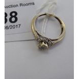 A 9ct white gold ring, set with diamonds, fashioned as a flower,